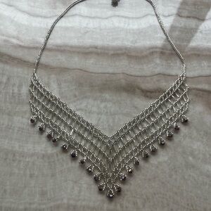 Intricate Silver and Purple V-Shaped Necklace
